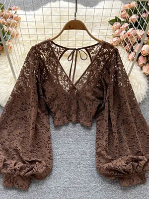 Women's elegant lace blouse with v-neckline and long sleeves open back